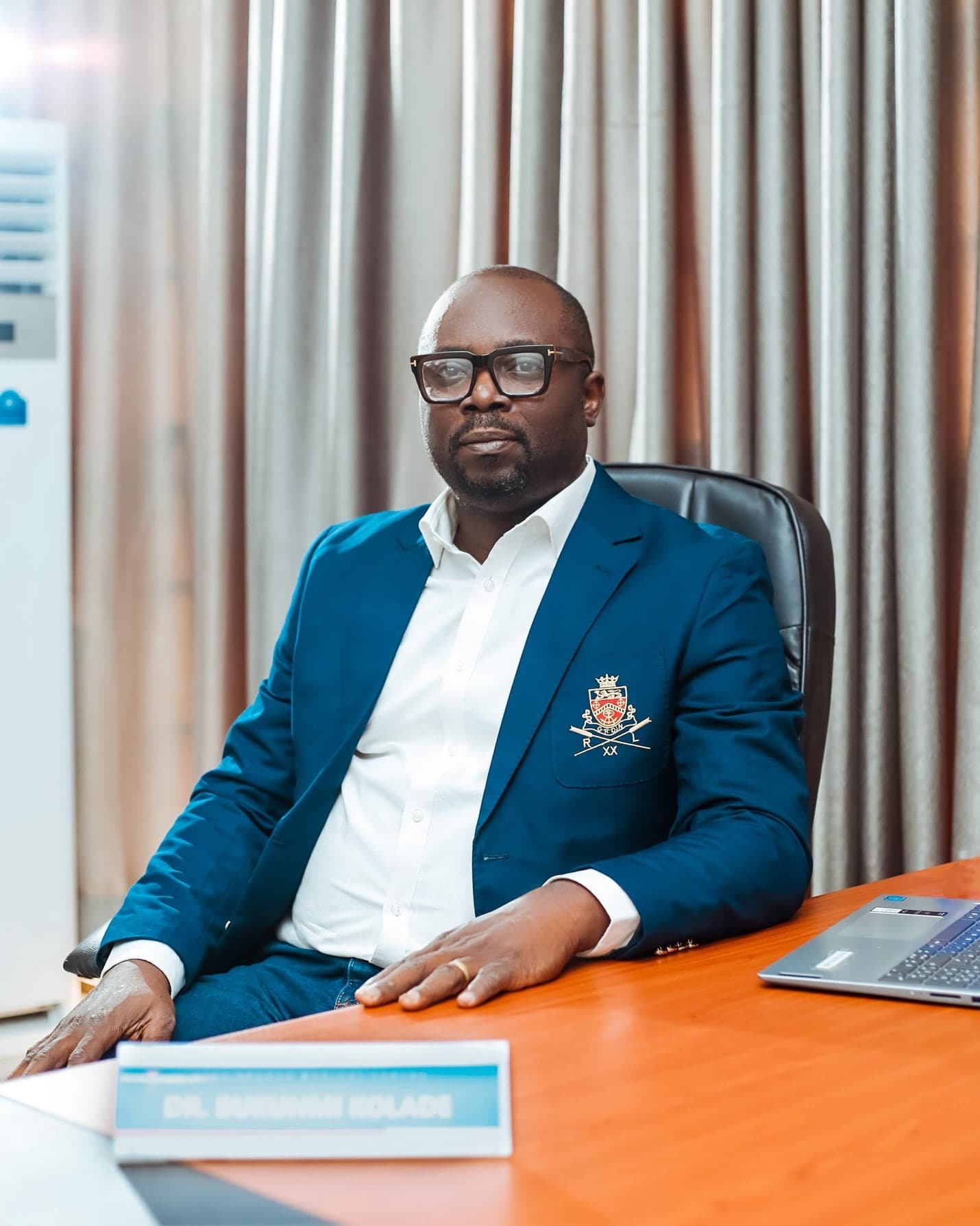 Dr. Charles Kolade